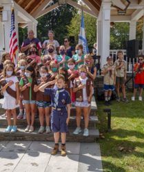 Boy Scout and Brownies giving the pledge of allegiance